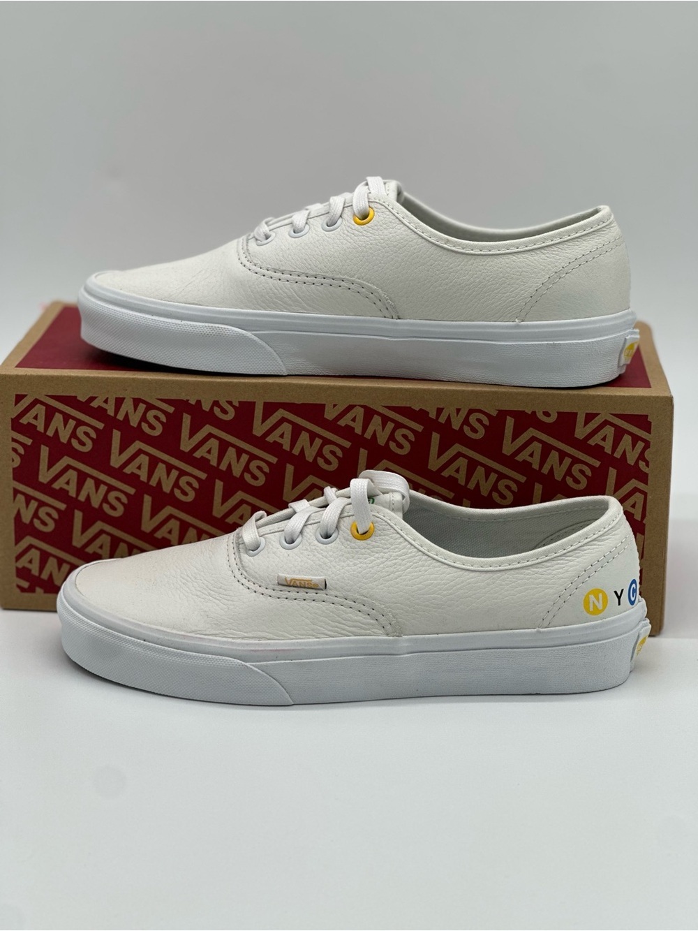 Vans White Low-Top Sneakers with Yellow Accent